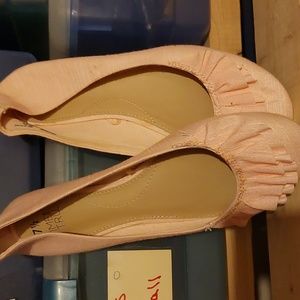 Pink flats with ruffle toe.
